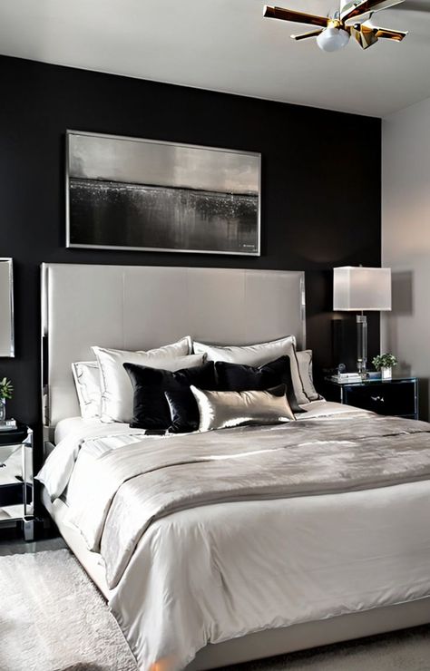 Create a sleek and modern look by pairing a black bed with crisp white bedding. Add elegance with a mirrored nightstand and complete the look with metallic accents and statement artwork on the walls. Furniture Ideas Bedroom, Bedroom Tile, Tile Bedroom, Bedroom Furniture Ideas, Black Bedroom Decor, Statement Artwork, Beautiful Bedroom Decor, Black Bed, Bedroom Wall Paint