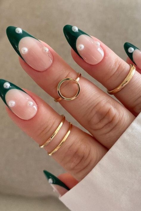 Green French Tip Nails With Pearls, Emerald Green Nails With Pearls, Dark Green Nails With Pearls, December Birthday Nails Acrylic, Trendy Almond Nails Winter, Green French Tip Nails Christmas, Green And Pearl Nails, Forest Green Nails Christmas, Christmas Nails With Pearls