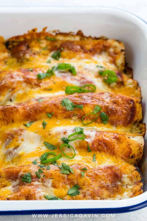 This easy chicken enchiladas recipe is an authentic Mexican food staple. Tender pieces of shredded chicken are rolled in flour tortillas and topped with a homemade enchilada sauce. The casserole is baked until the cheese is hot and melted. #cincodemayo #enchiladas #mexicanfood via @foodiegavin Healthy Chicken Enchiladas, Easy Chicken Enchiladas, Cream Cheese Chicken Enchiladas, Easy Chicken Enchilada Recipe, Chicken Enchilada Bake, Chicken Enchiladas Recipe, Authentic Mexican Recipes, Authentic Mexican Food, Cheesy Chicken Enchiladas