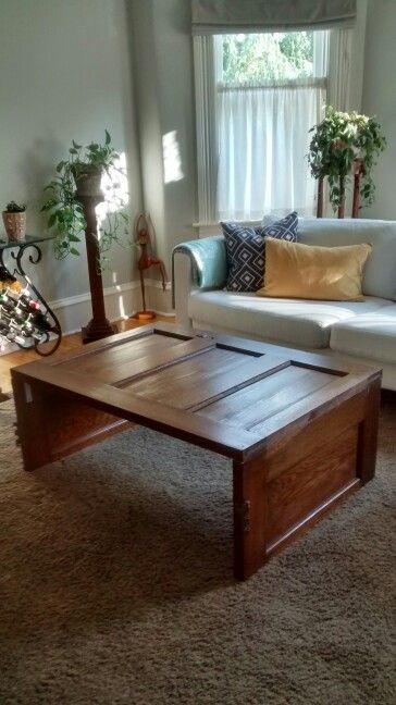 Old door coffee table Coffee Table From Old Door, Old Door Coffee Table, Vintage Doors Repurposed, Old Door Tables, Coffee Table Refinish, Rustic Ottoman, Recycle Projects, Door Coffee Tables, 4h Projects