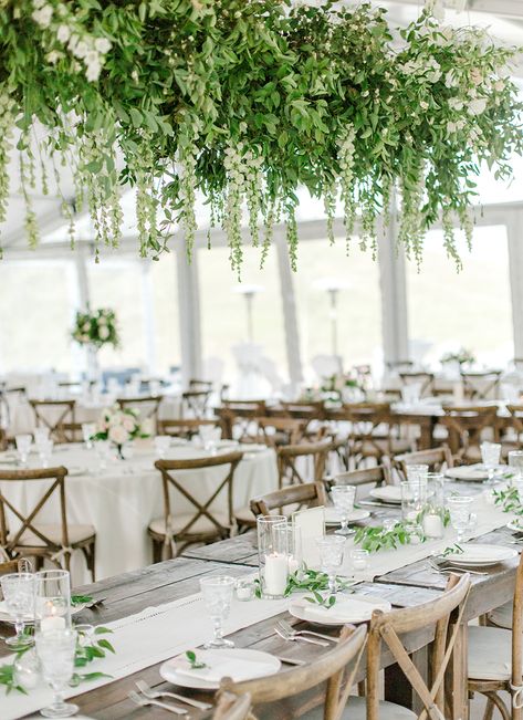 Andrea & Mikey | Romantic Blush Wedding in Steamboat tablescape with cascading, organic greenery and simple place settings Greenery Floral Installation, Hanging Greenery Wedding Ceilings, Greenery Installation Wedding, Hanging Floral Installation Wedding Tent, Hanging Wedding Installation, Hanging Floral Chandelier Wedding, Hanging Flower Installation Wedding, Tent Greenery Wedding, Hanging Greenery Installation