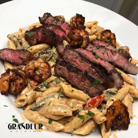 Surf and Turf Jerk Alfredo “Rasta Pasta “ /// shrimp and ribeye w/ jerk Alfredo sauce over pasta with peppers  and onions. Very tasty 😋 .//… Rasta Pasta Seafood, Jerk Rasta Pasta, Surf And Turf Pasta, Pasta With Peppers, Steak Ribeye, Pasta Shrimp, Rasta Pasta, Meal Prep Snacks, Healthy Food Menu