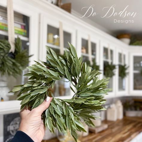 How To Hang Wreaths On Kitchen Cabinets Pantry Door Wreath Ideas, Kitchen Hood Wreath, Plants On Kitchen Cabinets, Christmas Wreath On Cabinet Door, Hang Wreaths On Cabinets, Wreath On Range Hood, Wreaths On Kitchen Cabinet Doors, Christmas Bows On Cabinets, Wreath Kitchen Cabinet