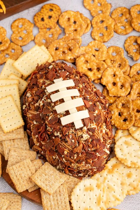 A savory football cheese ball is the best game day appetizer loaded with bacon, cream cheese, cheddar cheese, ranch seasoning, and crunchy pecans. Cheese Ball With Ranch Packet, Football Shaped Cheeseball, Cheese Ball Bacon Ranch, Reeces Pieces Cheese Ball, Bacon Ranch Cheese Ball Recipe, Oven Roasted Pulled Pork, Cheese Ball Recipes Easy, Football Party Foods, Sweet Potato Recipes Casserole