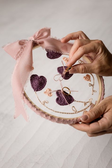 This handcrafted crochet ring holder adds a touch of rustic charm to your autumn country wedding.  

 Ditch the commonplace ring pillows and choose a personalized piece that transcends the fleeting nature of your special day.  This beauty combines the warmth of crochet with the elegance of embroidery, creating a timeless keepsake you'll cherish for years to come. Easily adapt it to your wedding venue's style, and afterwards, display it proudly on your wall or frame it as a cherished memory of your wedding celebration.  
.#embroideredwedding #DIYembroidery #handmadewedding #embroideryinspiration #weddingcrafts Appliques Au Crochet, Handmade Wedding Decorations, Rustic Wedding Ring, Traditional Wedding Rings, Crochet Appliques, Wedding Ring Holder, Crochet Embellishments, Wedding Kit, Rustic Wedding Rings