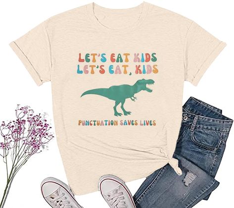 PRICES MAY VARY. Preschool Teacher Shirt: Cotton blend, soft, wrinkle free, breathable and stretchy fabric, comfy to your touch Funny Dinasour Shirt Ladies: This funny "Lets Eat Kids, punctuation saves lives" letter printed and dinasour graphic shirt is very cute and beautiful, lightweight, classic fit Dino T Rex Tee: Teacher shirts will be the best match with you, this women stretch top suitable for casual, daily wear, outdoor activities, vacation any other special occasion Kindergarten Teacher Funny Preschool Teacher Shirts, Funny Teacher Shirts, Teacher Tee Shirts, Kindergarten Teacher Gifts, Lets Eat, Preschool Teacher Shirts, Teacher T Shirts, Preschool Shirts, English Teacher Gifts