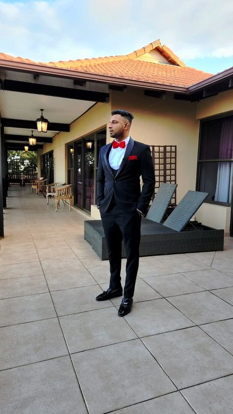 Black Suit Red Accents Men, Black Suit With Red Bow Tie, Red Bow Tie Outfit Men, Black Suit Red Bow Tie, Red And Black Suit For Men, Prom Suits For Men Red, Red Bow Tie Outfit, Black Suit With Red Tie, Black Formal Wedding Guest