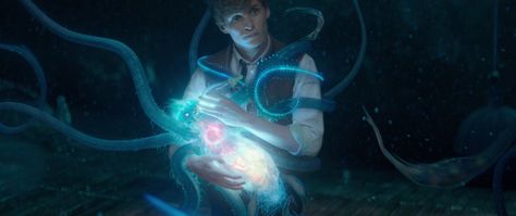 Newt is seen bottle-feeding a luminescent creature with tentacles, which the VFX house behind the shot named a Marmite    Fantastic Beasts And Where To Find Them, by Newt Scamander. Fantastic Beasts Niffler, Fantastic Beasts Movie, Gellert Grindelwald, Beast Wallpaper, Newt Scamander, Hogwarts Aesthetic, Eddie Redmayne, Fantastic Beasts And Where, Harry Potter Obsession