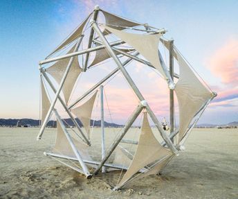 The piece is called 'Chirality', meaning 'handedness', and is a large scale tensegrity sculpture that was designed and built for Burning Man 2015 in the span of four months. It was built onsite by a dedicated crew of 8, with a total volunteer base of 30. Tensegrity structures are highly responsive, ultralight, and very strong. They also happen to be incredibly difficult to build, which is what made this such a fun engineering challenge. We set out to build a tensegrity structure that could b... Tensegrity Sculpture, Chuppah Ideas, 3d Forms, Burning Man 2015, Temporary Architecture, Tensile Structures, Engineering Challenge, Temporary Structures, Genius Loci