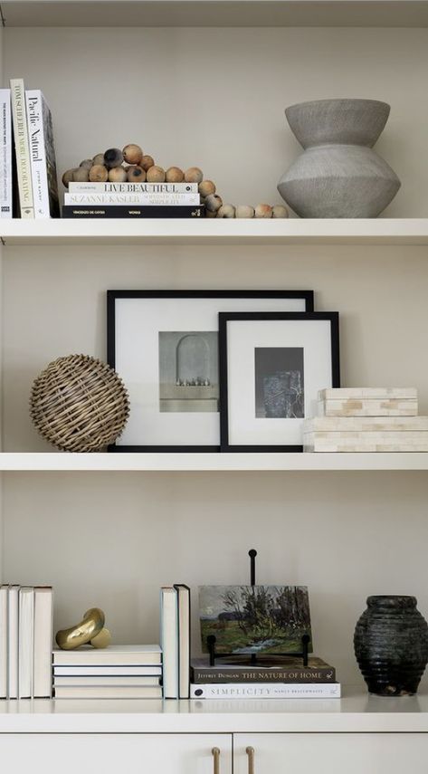 Simple Shelves Decor, Book Shelf Decor Living Room Modern, Minimal Floating Shelf Decor, Contemporary Living Room Shelves, Gallery Above Console Table, Simplistic Shelf Decor, White Shelves Styling, Modern Coastal Shelf Styling, Shelf Styling Living Room Modern