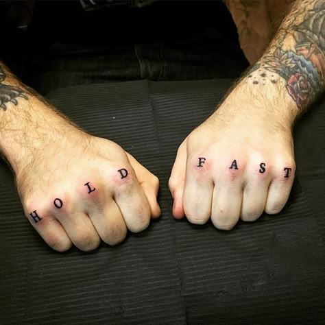 Words ‘hold fast’ inked on the knuckles of the both hands Cool Hand Tattoos, Hold Fast Tattoo, Tattoos Words, Finger Tattoos Words, Belly Tattoos, Knuckle Tattoos, Hold Fast, White Tattoo, Abstract Tattoo