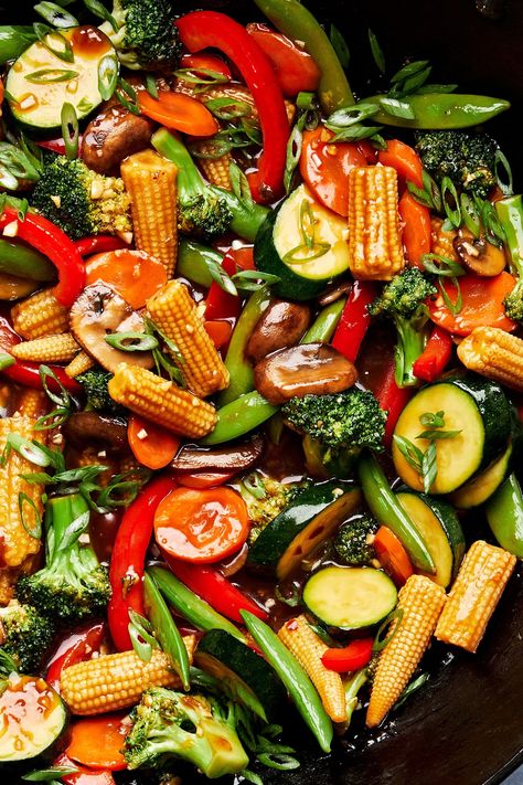 We love this easy veggie stir fry for its delicious homemade sauce and super customizable ingredient list. Make a pot of rice, and dinner is served! Veggies For Stir Fry, Teriyaki Veggie Stir Fry, Vegan Veggie Stir Fry, Stir Fry Veggies Sauce, Stir Fry Veggies And Rice, Asian Veggie Stir Fry, Vegetables Dinner Recipes, Teriyaki Stir Fry Vegetables, Healthy Stir Fry Recipes Clean Eating