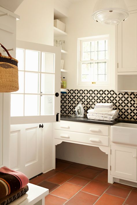 Laundry room in a Spanish Revival Built In Dog Bed, Black And White Backsplash, Traditional Laundry Room, Dutch Doors, Laundry Room/mud Room, White Tile Backsplash, White Backsplash, Dutch Door, Classic Kitchen