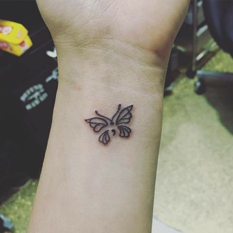 Cute little semicolon butterfly tattoo Semi-colon Butterfly Tattoos, Semi-colon Tattoo Ideas Wrist, Butterfly Semi Colon, Butterfly Tattoo Aesthetic, Butterfly Tattoo With Semi Colon, Semi Colon Tattoo Ideas, Semi-colon Butterfly Tattoo, Butterfly Tattoo Wrist, Butterfly Semicolon Tattoo