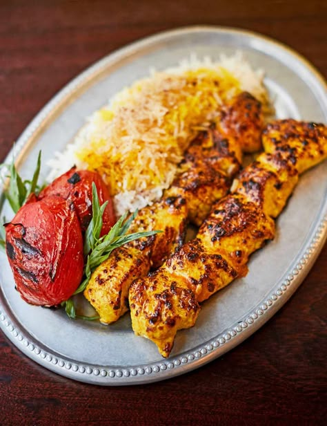 Jujeh Kabab Recipe Reflecting the food of Tehran's hole-in-the-wall kabab houses, Berenjak restaurant's convivial cooking is ideal to recreate at home. Try this chicken kebab as part of a meze feast Jujeh Kabob Recipe, Jujeh Kabob, Meze Recipes, Persian Food Iranian Cuisine, Arabisk Mad, Persian Chicken, Meze Platter, Chicken Kebab Recipe, Yalda Night