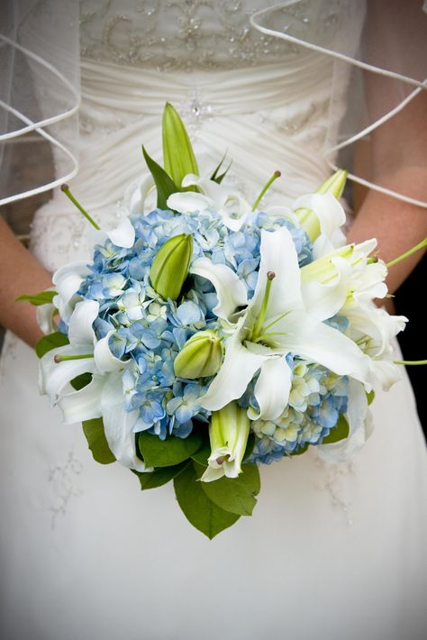 Blue hydrangea and oriental lily bride Blue Hydrangea White Lily Bouquet, Hydrangea Lily Bouquet, Hydrangea And Lily Bouquet, Lily And Hydrangea Bouquet, Blue Hydrangea Wedding Bouquet, Calla Lillies Centerpieces, Wedding Flowers Lilies, Tiger Lily Bouquet, Blue Hydrangea Centerpieces