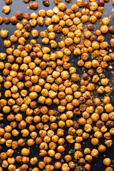 Learn how to make oven roasted chickpeas that are actually crispy and stay that way! All you need is a can of chickpeas, a tiny bit of oil and seasoning of your choice. | Gluten Free Vegan Crispy Chickpeas Oven, Roasted Chickpeas Oven, Roasted Chickpeas Recipe, Crispy Roasted Chickpeas, Chickpea Recipes Roasted, Chickpeas Recipe, Crispy Chickpeas, Roasted Chickpeas, Chickpeas