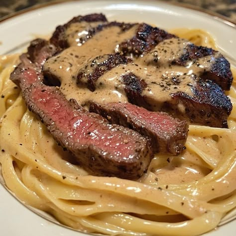 🔥🧄 Creamy Cajun Steak Alfredo 🥩🍝 Ingredients 1 lb steak 🥩 (ribeye, sirloin, or your choice) 8 oz fettuccine or linguine pasta 🍝 1 tbsp Cajun seasoning 🌶️ 1 tbsp olive oil 🫒 2 tbsp butter 🧈 3 cloves garlic, minced 🧄 1 cup heavy cream 🥛 1 cup Parmesan cheese, grated 🧀 Salt & pepper to taste 🧂 Fresh parsley, chopped 🌿 (for garnish) Instructions Cook the Pasta: Bring a large pot of salted water to a boil. Cook the fettuccine or linguine according to package directions until al dente. Drain and s... Steak Noodles Recipes, Honey Roasted Sweet Potatoes, Steak And Pasta, Cajun Steak, Steak Alfredo, Steak Ribeye, Steak Pasta, Linguine Pasta, Boiled Food