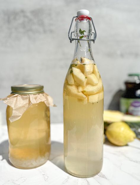 How to make water kefir fermented fruit juice. Water kefir in a jar fermenting and fermented fruit juice in a tall jug. Fermented Fruit, Homemade Bolognese Sauce, Water Kefir Grains, Kombucha Bottles, Peach Water, Food Vibes, How To Make Water, Sourdough Bread Sandwiches, Kefir Recipes