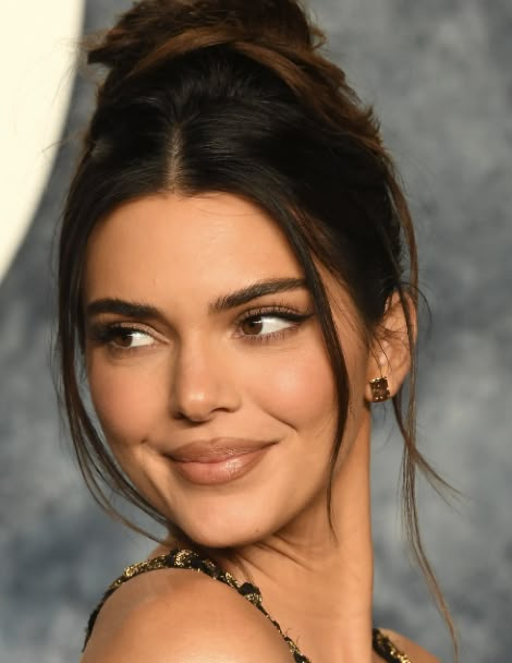 Face Framing Tendrils Updo, Kendall Jenner High Bun, Kendall Jenner Slicked Back Hair, Kendall Jenner Slick Bun, Buns For Round Faces, High Bun With Face Framing Pieces, Slick Bun With Front Pieces Out, Kendall Jenner Updo, Slick Back Formal Hair