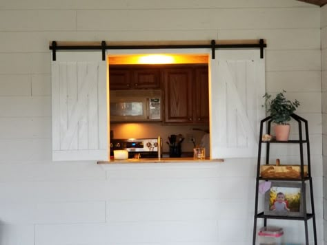 This was the kitchen window BEFORE the livingroom addition was added.  It is now window, pass through and aesthetically pleasing feature in both livingroom and kitchen. Kitchen Pass Thru Windows, Kitchen Window Into Living Room, Kitchen Pass Through With Doors, Kitchen Window Pass Through Ideas, Serving Window Kitchen To Living Room, Closing Kitchen Pass Through, Pass Thru Kitchen Window To Living Room, Kitchen With Hatch, Peekaboo Window In Kitchen