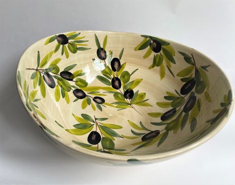 Hand-painted, made in Italy  has a beige painted background with olive design.  30 cm D or approx. 11 in (medium serving bowl)  Sizes are approximate as each item is hand made so variations occur.  Dishwasher safe. Ceramic Olive Bowl, Green Pottery Painting, Bowl Ceramic Painting, Hand Painted Pottery Bowls, Pottery Painting Bowl, Bowl Painting Ideas, Bowl Painting, Italian Bowl, Olive Design