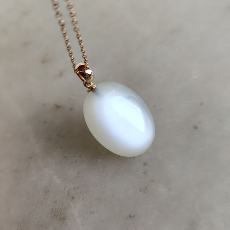 This stunning pendant is set in 14K Solid Yellow Gold with Natural White Moonstone with utmost precision. It is an unique gemstone pendant for nearly every occasion and is completely hassle-free jewelry. ITEM DETAILS * Gem: White Moonstone * Gem Size: 17X22mm * Gem Shape: Oval * Gem Weight: 26.32 carats * Gold Purity: 14KT  * Gold Weight: 0.42 gram * Total Weight of the Pendant: 5.69 gram The Gold purity is guaranteed and it comes with authentic 14KT gold hallmark. Since my items are handmade, they are absolutely nickel and lead free. Natural White Moonstones cabochon with drill setting and gold bail are studded on it with utmost precision.  CUSTOMIZATION * Gemstone customization is available and it can be substituted with a gem of your choice. Kindly message me for the same. PACKAGING * T Wizard Jewelry, Ethereal Jewelry, Oval Jewelry, Jewelry Accessories Ideas, White Moonstone, Birthstone Pendant, Jewelry Lookbook, June Birthstone, Moonstone Jewelry