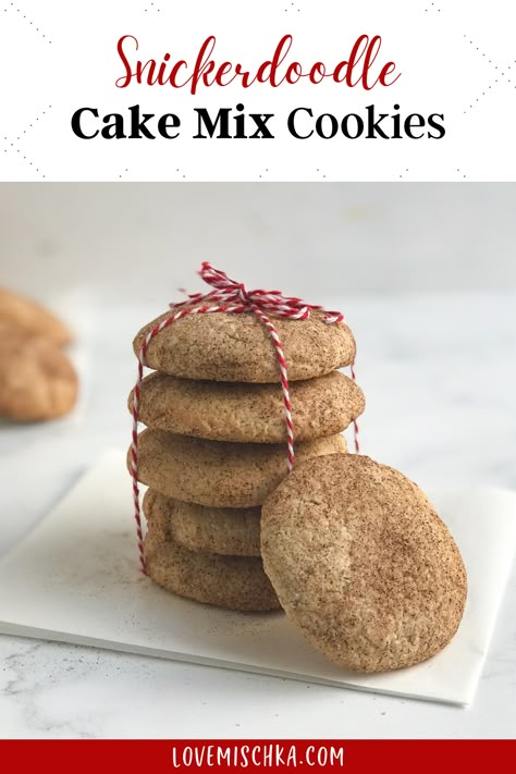 A snickerdoodle white cake mix cookie, coated with a mixture of brown ground cinnamon and white granulated sugar, leans against a stack of snickerdoodle cake mix cookies held together by red and white twine that is tied in a bow. Snickerdoodle Cookies Recipe Easy, Brownie Hacks, Snickerdoodle Cake, Snickerdoodle Cookies Easy, Cake Mix Brownies, Cake Mix Recipe, Daniel Fast Recipes, Cake Mix Cookie Recipes, Snickerdoodle Cookies