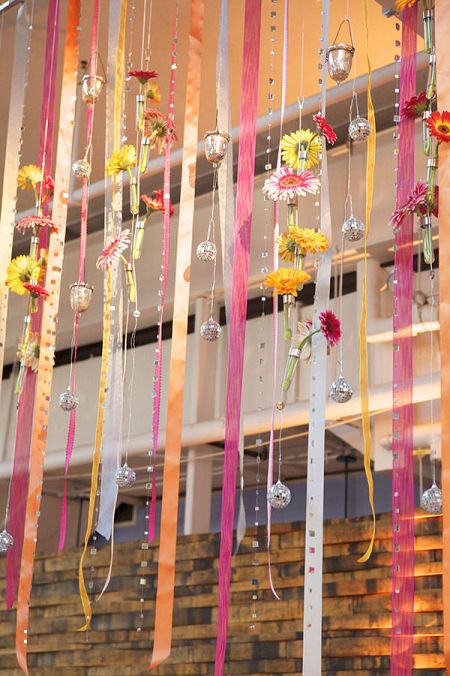 Wedding curtain made up of ribbons, flowers and ornaments. #Reception #Decor #Ribbons #Celebstylewed. @Celebstylewed Ribbon Wedding Decorations, Ribbon Curtain, Ribbon Backdrop, Fiesta Wedding, Curtain Backdrops, Flower Curtain, Ribbon Decorations, Baltimore Wedding, Ribbon Art