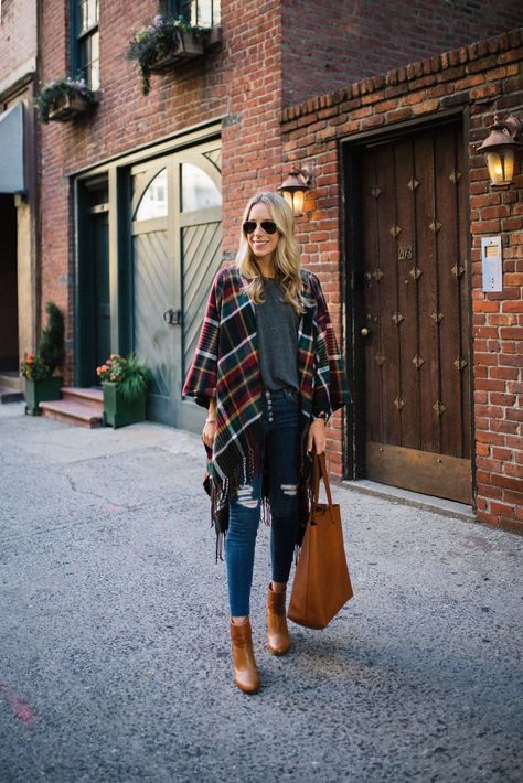 Ever wondered how to style a plaid blanket wrap? Here's an easy idea for how to wear one of autumn's coziest accessories. Wrap Outfits For Women, Blanket Wrap Outfit, How To Wear A Ruana, Wrap Outfit Shawl, Oversized Wrap Shawl For Fall, Flannel Poncho Outfit, Shawl Outfits, Plaid Long Sleeve Poncho For Fall, Plaid Shawl Scarf For Fall