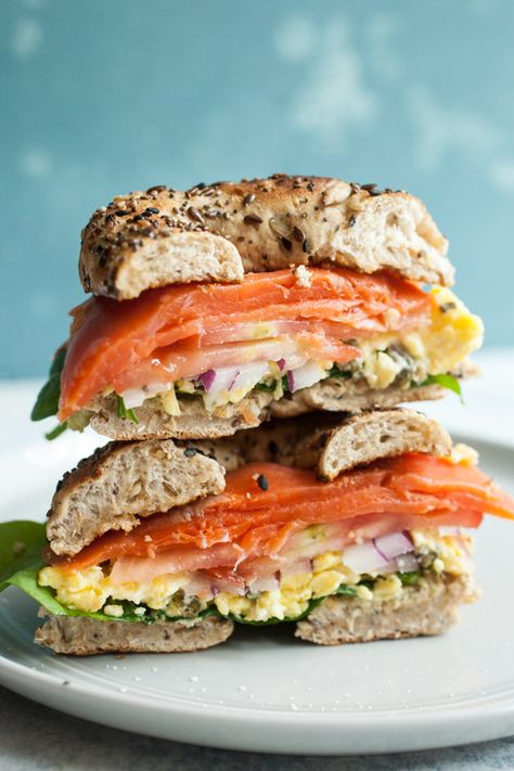 This hearty breakfast sandwich is easy to build and perfect for this time of year when tomatoes are at their best. Don't forget the caper scrambled eggs. They make the sandwich special! macheesmo.com #breakfast #easy #lox #sandwich #bagels Lox Sandwich, Best Bagel Sandwich Recipe, Salmon Bagel Sandwich, Bagel Lox, Bagel And Lox Sandwich, Lox Breakfast, Salmon And Lox Bagels, Salmon Lox Bagel, Lox Recipe