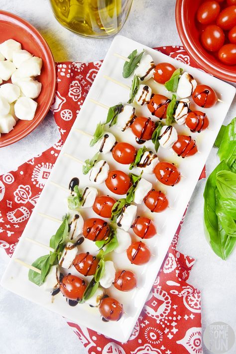 Caprese Salad Skewers are easy to serve and are always a crowd pleaser.  The flavors of tomato basil and mozzarella mingle together to make one perfect bite. #capreseskewers #caprese #capresesaladskewers #capreseskewersbalsamic #balsamic #basil #tomato #capresesalad #italian #appetizer #capreseappetizer #partybite #bitesized #saladskewer #party #recipe #partyappetizer #easyappetizer Mozerella And Tomato Skewers, Mozerella Tomato Caprese, Skewer Ideas, Tomato Mozzarella Skewers, Mozzarella Tomato Basil, Tomato Basil And Mozzarella, Tomato Skewers, Salad Skewers, Caprese Appetizer