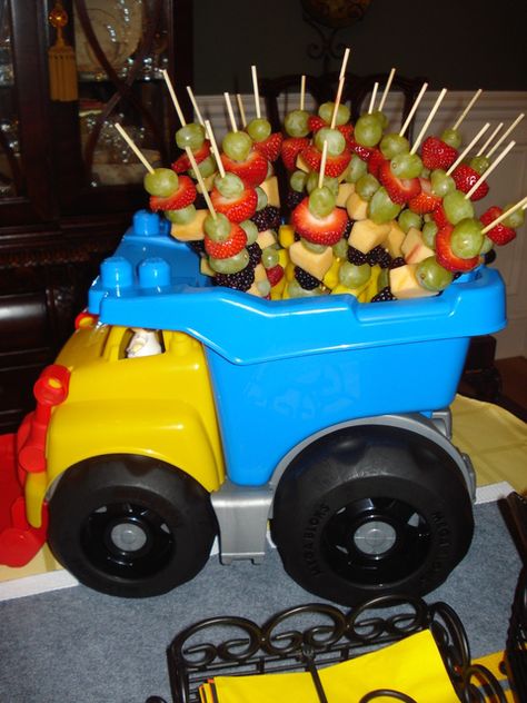 Under Construction centerpiece with fruit skewers #underconstruction #fruitskewers Construction Baby Shower, Dump Truck Birthday, Construction Theme Party, Truck Birthday Party, Baby Shower Party Ideas, Construction Birthday Parties, Shower Party Ideas, Monster Truck Birthday