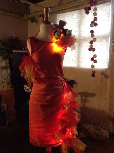 Girl on fire costume Fire Costume Diy, Stroller Costume, Fire Theme, Phoenix Costume, Fire Costume, Rainbow Wedding Dress, Fire Princess, Fire Dress, Hunger Games Fashion