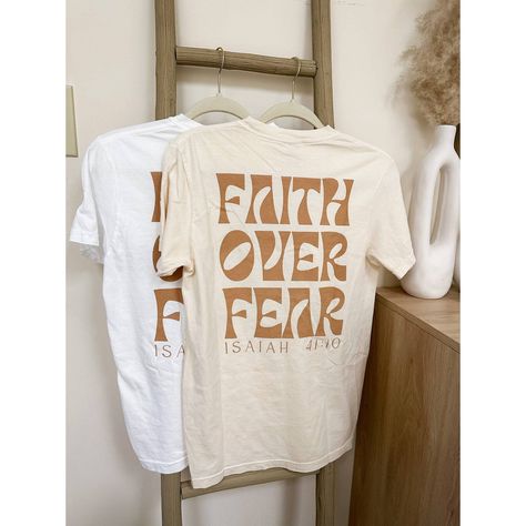 Faith Over Fear Graphic Tee | Screen Print Graphic Tshirt | Christian Apparel | Christian Tshirt | Graphic Christian Tee Faith Over Fear Graphic Tshirt Sizing: Unisex (See Size Guide In Photos For Measurements) Color: Ivory 100% Cotton Brand: Comfort Colors Design Bible T Shirt Design, Art T-shirts, Christian Tshirt Design Ideas Minimalist, Cute Christian Graphic Tees, Bible Verse Shirt Design, Church T Shirt Ideas Design, Church Merch Ideas, Trending T Shirt Designs, Christian Tshirt Design Ideas