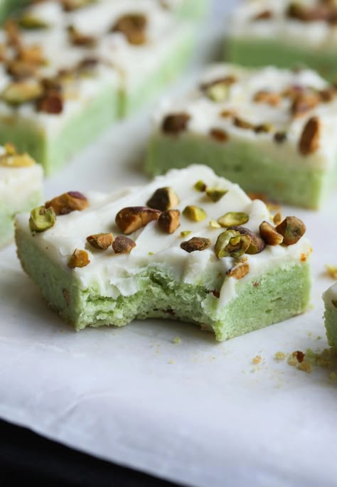 These Easy Pistachio Sugar Cookie Bars are flavored with pistachio pudding mix, topped with cream cheese frosting, and chopped pistachios! The pretty green color makes them as festive as they are delicious! #cookiesandcups #pistachiobars #sugarcookiebars #pistachio #imperialsugar Pistachio Bars, Pistachio Pudding Cookies, Pistachio Dessert, Cookies And Cups, Pistachio Recipes, Pistachio Cookies, Pistachio Pudding, Pudding Cookies, Sugar Cookie Bars