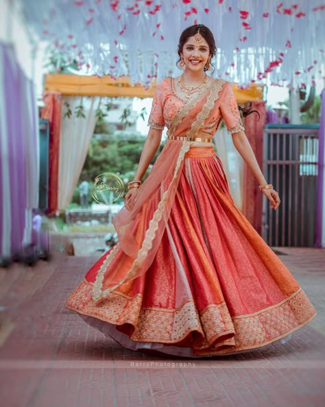 A Pretty kanjivaram lehenga for this beautiful bride. The intricate embroidered blouse adding oodles of charm to the ensemble. Couples with her subtle makeup and minimal jewellery the look is an inspiration to ape for. PC: barrys.photograph #indianwedding #wedding #indianbride #bride #southindianbride #southindianwedding #saree #kanjivaram #kanjivaramsaree #lehenga #wittyvows #indianjewellery Saree Lehenga Designs, Bridal Half Saree, Kanjivaram Lehenga, Saree For Engagement, Saree South Indian, Engagement Dress For Bride, South Indian Wedding Saree, South Indian Bride Saree, Kanjeevaram Sarees