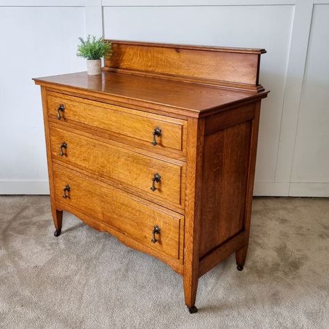 A beautifully proportioned set of oak chest of drawers on castors. Made in the 1930's, it makes beautiful statement piece that can be dressed up or down.

 Featuring three spacious drawers with decorative drop handles the chest is perfect for adding storage within the home. The upstand adds character to the piece whilst it's golden tones give it a rustic and timeless feel.
 
#Bedroominspiration #bedroomstorage #rusticdecor #chestofdrawers #vintagedecor #vintageideas 1930s Bedroom Furniture, 1930 Furniture, 1930 Bed, 1930s Bedroom, 1930s Furniture, 1930s Vanity With Mirror, 1930’s Furniture, 1940s Bedside Table, Chest Of Drawers Bedroom