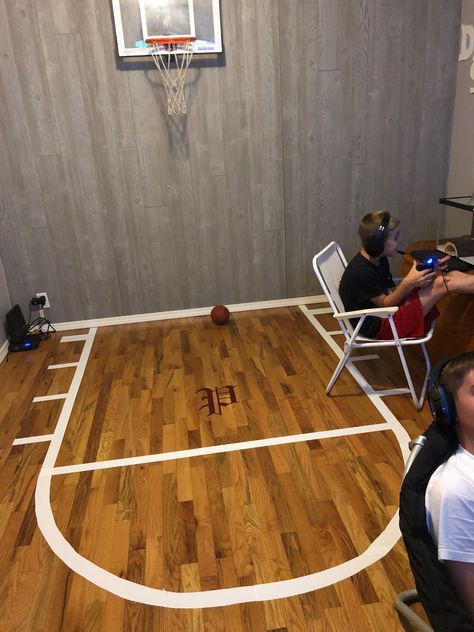 Game room with a basketball court cut out in vinyl. Basement Basketball Hoop, Basketball Bedroom, Basketball Court Flooring, Fun Living Room, Color Palette Interior Design, Basketball Floor, Basketball Room, Shoe Room, Basketball Wall