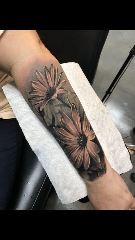 Black and white Daisy tattoo Daisies Tattoo Sleeve, Dandelion Flower Tattoo Black And White, Masculine Daisy Tattoo, Black And White Flower Tattoo Designs, Black And Gray Daisy Tattoo, Gerber Daisy Tattoos For Women, Daisy Tattoo For Men, Daisy Tattoo Black And White, Black Daisy Tattoo