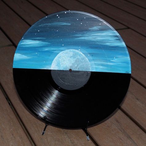 This painting would make an amazing addition to your home decor or any art collection! Acrylic Painting of Night Sky with the Moon on a Vinyl Record. This painting can be framed and hung on a wall, or displayed in a stand. Stand Is not included. Original Acrylic painting by Tara Valentino Year: 2020 Diameter: 12 inches Painted Records Vinyl Trippy, Painting Records Ideas, Vinyl Record Art Aesthetic, Painting Vinyl Records, Vinyl Painting Ideas, Painted Vinyl Records Wall Art, Record Painting Ideas Easy, Disk Painting, Painted Records Vinyl