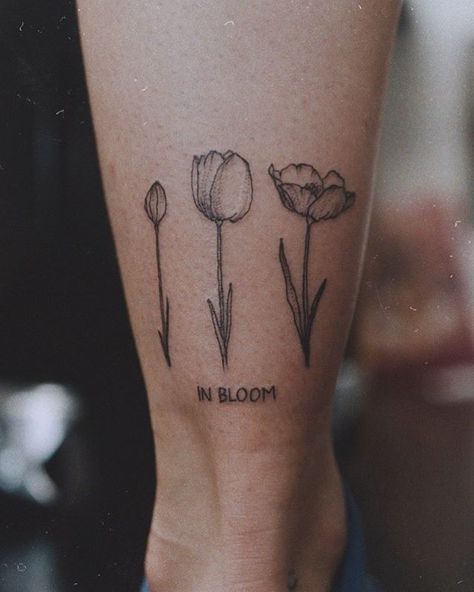 in bloom💕✨ thank you so much! Bloom Tattoo Words, In Bloom Tattoo, Heartbreaker Tattoo, Blooming Tattoo, Gardening Tattoo, Bloom Tattoo, Cursive Tattoos, Mommy Tattoos, Cute Tattoos For Women