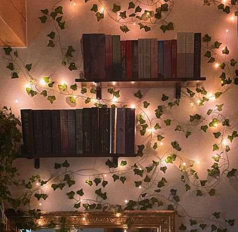 Fairy Core Bookshelf, Room Decor Ideas Bookshelf, Bookshelf Design Aesthetic, Fairycore Bookshelf, Fairy Lights Shelves, Forest Green Library Room, Vines On Bookshelf, Vine Bookshelf, Green Book Room