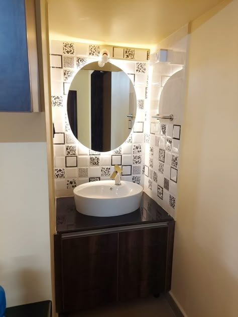 A vanity with marble counter top, a bowl sink, and mirror back lighting. A wall mounted storage units floor space. DM us your interior queries or to speak to a designer! #noida #noidadiaries #noidagram #noidacity #noidafoodie #noidablogger #greaternoida #noidaextension #delhi #delhifoodie #delhiblogger #delhigram #delhidiaries #delhifood #delhifoodblogger #instadaily #instagram #insta #instalike #instamood #reel #reelindia #mumbai #navimumbai #reelsinstagram #classicinfrahomes Basin Counter Design Cabinets, Washbasin Counter Design, Table Top Wash Basin Ideas, Wash Basin Unit, Wash Basin Mirror Design, Bathroom Basin Design, Counter Top Washbasin, Wash Basin Ideas, Wash Basin Design