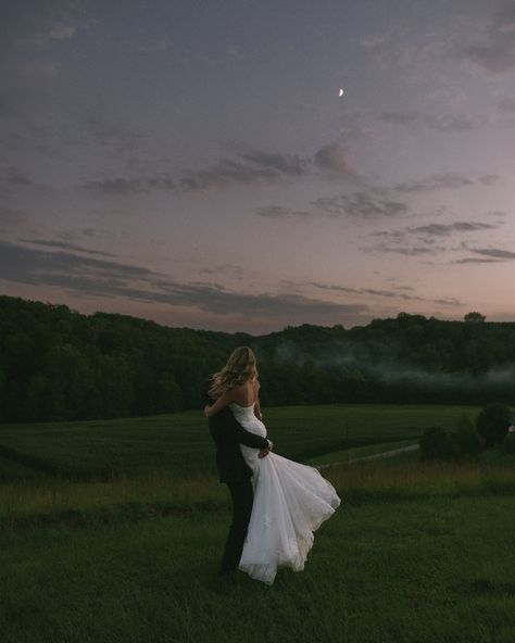 Romantic wedding photos at night. Evening wedding photos with the moon. Candid romantic wedding photos. Bride and groom embracing under the moon. Candid and romantic wedding posing. Sunset and moon wedding photos. Venue: @thebarnatmountliberty #indianaweddingphotographer #cincinnatiweddingphotographer #ohioweddingphotographer #kentuckywed... Wedding At Night, Wedding Photo Ideas Night, Wedding Photos At Night, Wedding Sunset, Full Moon Wedding, Romantic Elopement, Wedding Venues Sunset, Bride And Groom Pictures Romantic, Wedding Photo Ideas Candid