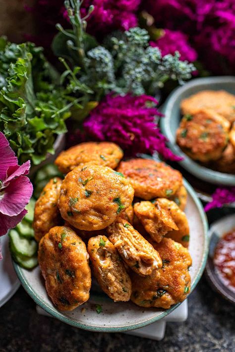 Prepare your taste buds for a culinary journey to Thailand with Thai fish cakes Tod Mun Pla, a beloved delectable morsels and Thai street food delicacy that will leave you craving more. An easy and high protein appetizer that can be made in 20 minutes! #thaifishcakes #todmunpla #todmanpla #thaifishcakerecipes #thaifish #thaifishrecipes #authenticthaifishcakes #todmunplarecipes Authentic Thai Recipes, Thai Fish Cakes, Sweet Chili Dipping Sauce, Thai Fish, Spicy Appetizers, Fish Cakes, Thailand Food, Thai Street Food, Seafood Appetizers