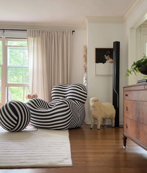 Funky black and white striped chair in ecclectic living room Black White Chairs Living Room, Striped Modern Accent Chairs, Black And White Stripped Rug Bedroom, Black And White Striped Chair, Striped Wallpaper Black And White, Vintage House Interior, Black And White Striped Wallpaper Awstetic, Striped Armchair, Cozy Neutral Living Room