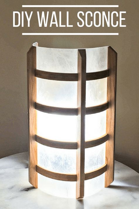 I love the Japanese-inspired look of this DIY wall sconce! Get the tutorial to make your own at The Handyman\'s Daughter! | DIY lighting | DIY lamp | DIY home decor | #DIYlighting Plexiglass Diy Projects, Cardboard Lighting, How To Cut Acrylic, Diy Wooden Wall, Plexiglass Sheets, Lighting Diy, Japanese Lantern, Diy Lampe, Farmhouse Side Table