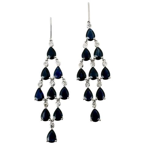 A vintage pair of platinum sapphire and diamond drop earrings with each earring consisting of 9 drop shape dark blue sapphires and 9 bezel set round brilliant cut diamonds arranged into a kite shape chandelier motif and suspended from a hook fitting - these stunning elegant and versatile earrings would easily take you from lunch to dinner and beyond - unmarked - sapphires 18=16.00cts dark blue Australian type - diamonds 18=0.36cts I/SI - total weight of the pair 11.84grms - overall dimensions in Diamond Chandelier, Black Onyx Jewelry, Sapphire And Diamond Earrings, Black Hills Gold, Black Sapphire, Onyx Jewelry, Diamond Drop Earrings, Diamond Drops, Sapphire Diamond