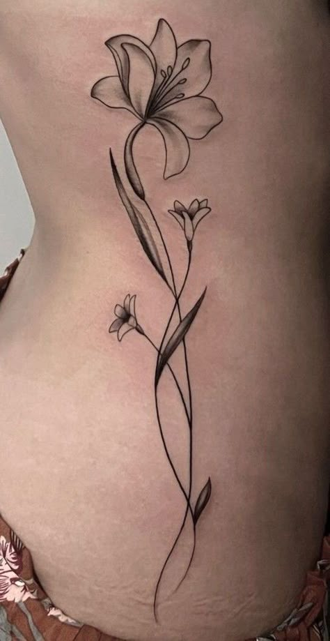 Lily Spine Tattoos For Women, Tulip Hip Tattoo, Side Of Stomach Tattoo For Women, North Tattoo, Calla Lily Tattoo, Lilly Flower Tattoo, Lily Flower Tattoo, Dark Skin Tattoo, Lillies Tattoo